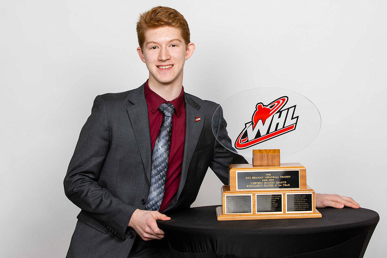 Silvertips goaltender Dustin Wolf poses with the Doc Seaman trophy after being named the WHL’s scholastic player of the year at ceremony on May 1, 2019, in Red Deer, Alberta, Canada. (WHL photo)