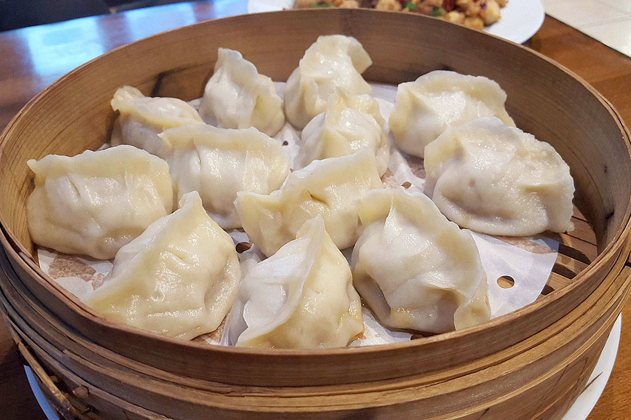 Dumpling Generation’s pork and cabbage dumplings are served in bamboo baskets. (Evan Thompson / The Herald)