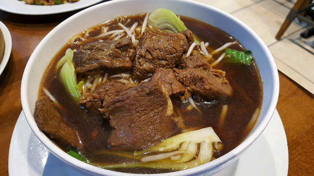 The braised beef noodle soup comes with bok choy. (Evan Thompson / The Herald)
