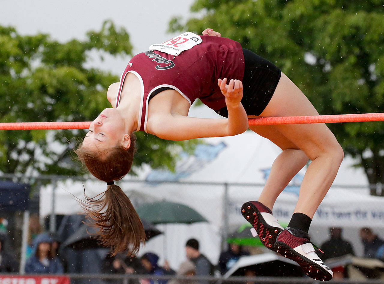Cascade’s Katie Nelson clears the high bar at the state track and field championships on May 25, 2019, at Mount Tahoma Stadium in Tacoma. (Andy Bronson / The Herald)