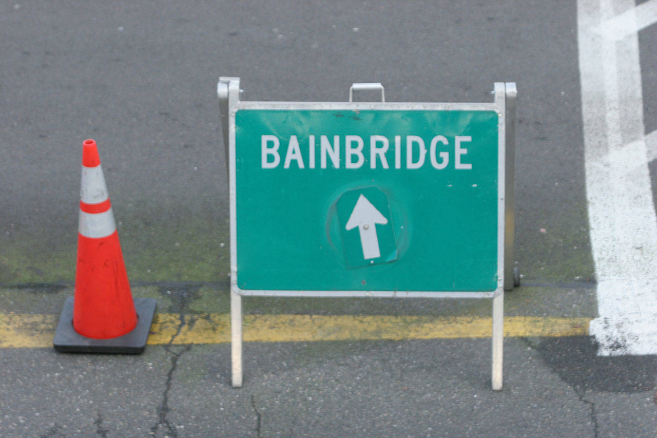 A sign points the way to the Bainbridge Island ferry. (Bainbridge Island Review)