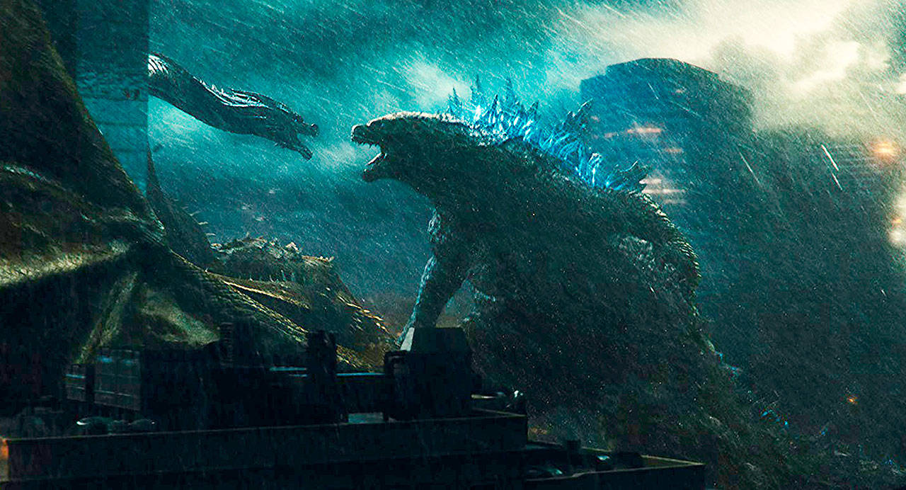 As special effects-enhancing rains falls, prehistoric monsters square off in “Godzilla: King of the Monsters.” (Warner Bros. Pictures)