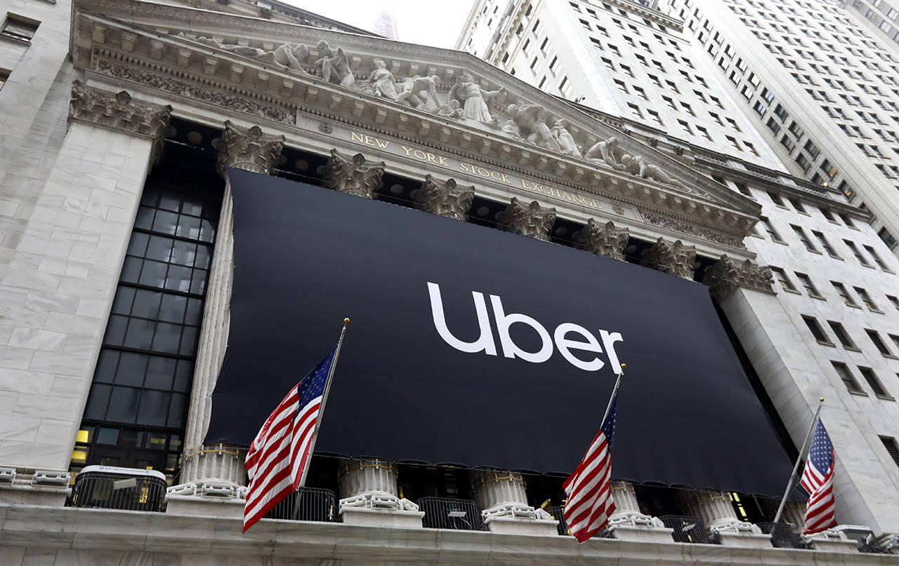 The Uber banner hangs on the facade of the New York Stock Exchange on May 10. (AP Photo/Richard Drew)