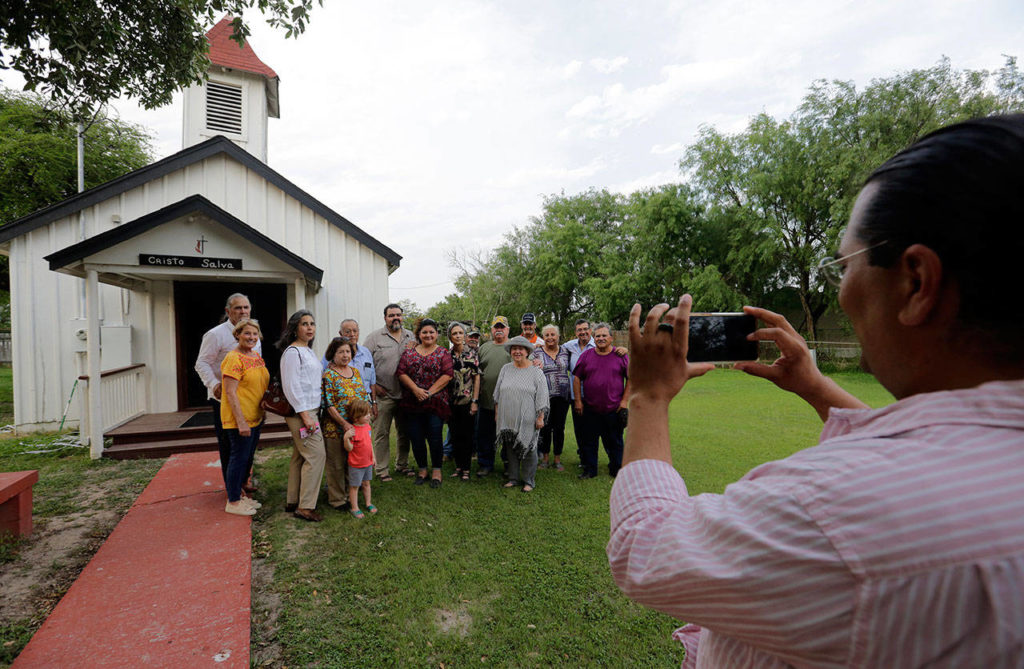 Descendants of Nathaniel Jackson pose for a photo at the Jackson Ranch in Pharr, Texas, on May 1. The family has hired lawyers and lobbied the U.S. government to spare their ancestral property from a border wall, which work crews are expected to start building nearby in the coming weeks. (AP Photo/Eric Gay)
