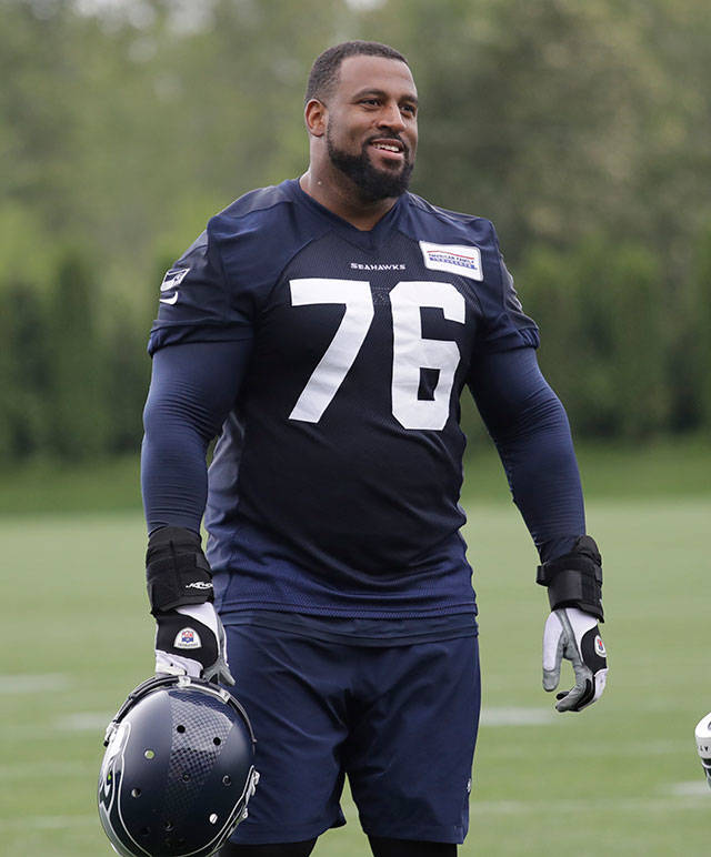 Seahawks offensive lineman Duane Brown walks on the field after a practice on May 21, 2019, in Renton. (AP Photo/Elaine Thompson)