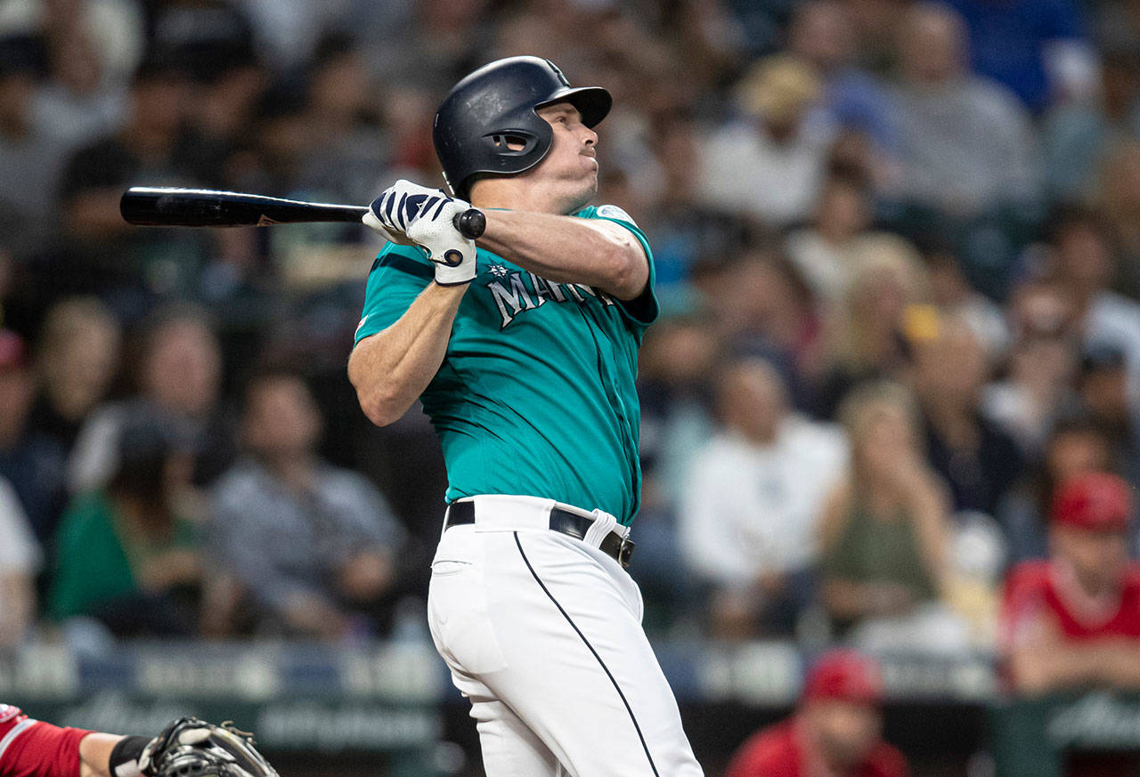 The Mariners’ Jay Bruce hits a solo home run off of Angels starting pitcher Tyler Skaggs during the seventh inning of a game on May 31, 2019, in Seattle. The home run was the 300th of Bruce’s career. (AP Photo/Stephen Brashear)