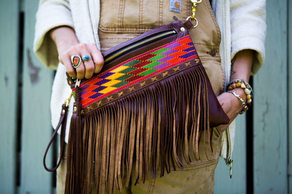 Madeline Chadwick models a Yucatán crossbody bag at her home in Lake Stevens. (Olivia Vanni / The Herald)
