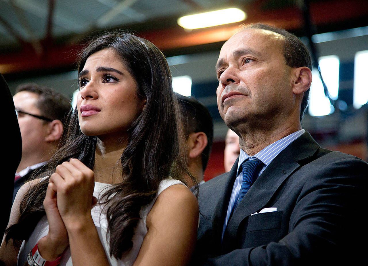 Actress Diane Guerrero and Rep. Luis Gutierrez, D-Ill., listen as President Barack Obama speaks about immigration at Del Sol High School in Las Vegas on Nov. 21, 2014. Guerrero, who rose to fame for her role in “Orange is the New Black,” is doubling down on her activism for immigrant youth. (Carolyn Kaster/AP)