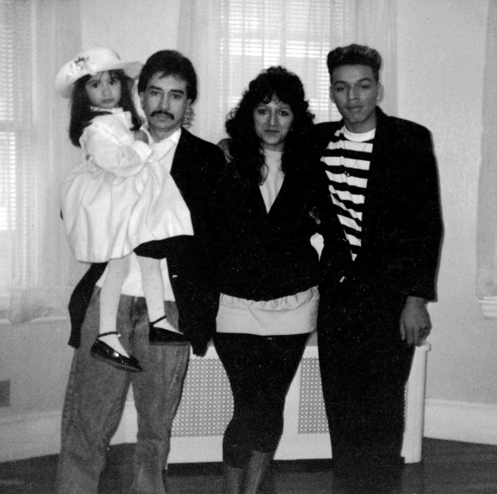 Diane Guerrero, left, with her parents and half brother, Eric, in an undated photograph from Guerrero’s memoir “My Family Divided.” At 14, Guerrero was separated from her family when they were deported to Colombia. (Courtesy of Diane Guerrero)

