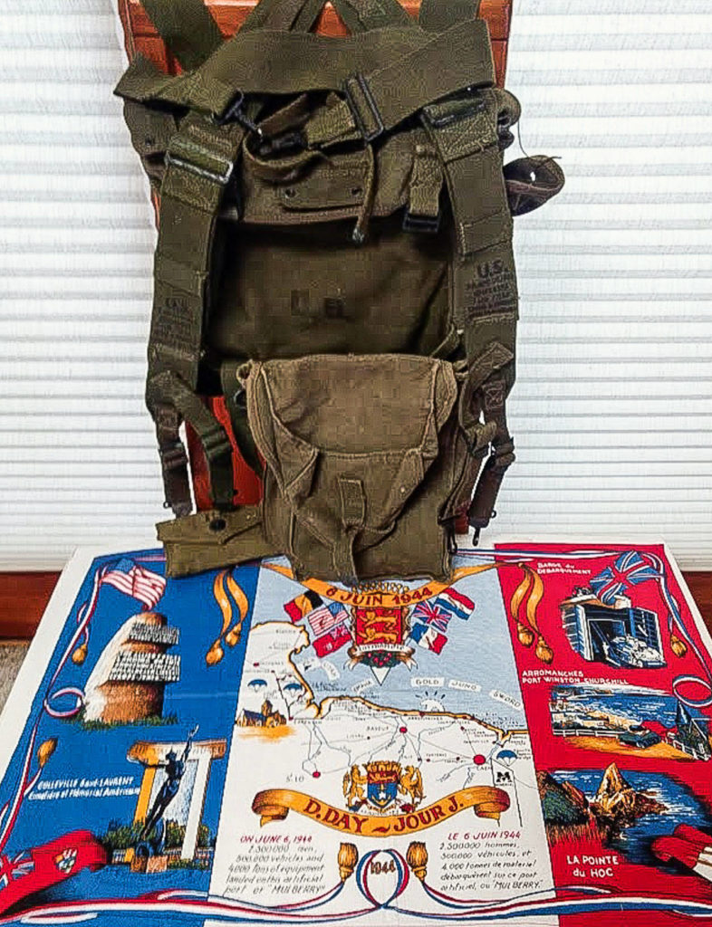 A U.S. Army pack carried by John Hinchcliffe on June 6, 1944, when as a platoon leader with the 1st Infantry Division he was part of the first wave to storm Omaha Beach. The display includes a map of Normandy. (Contributed Photo)
