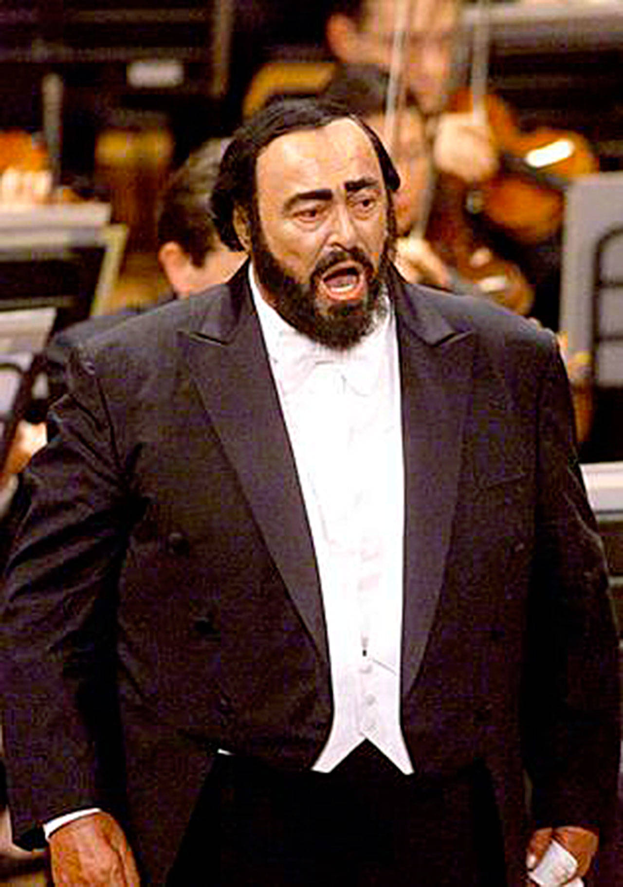 Luciano Pavarotti sings during a concert marking the 40th anniversary of his debut in his native town of Modena, central Italy, on April 29, 2001. Pavarotti made his debut as Rodolfo in Puccini’s “La Boheme” at Reggio Emilia, Italy, in 1961. (AP Photo/Paolo Ferrari, files)
