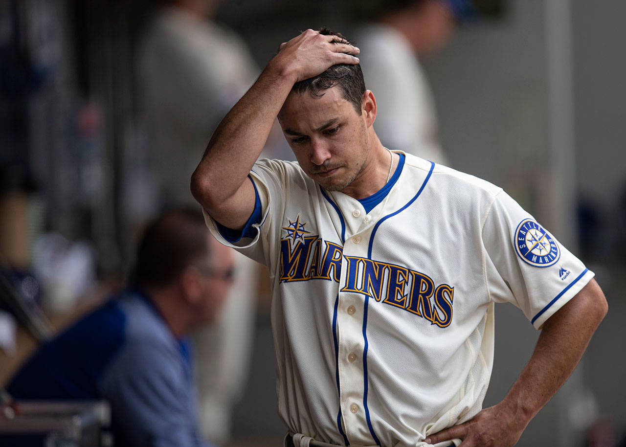Seattle Mariners starting pitcher Marco Gonzales walks through the dugout after being pulled from Sunday’s game against the Los Angeles Angels. (AP Photo/Stephen Brashear)
