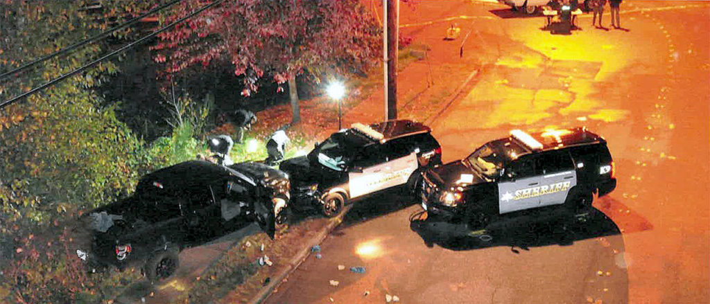 After a high-speed chase, sheriff’s deputies rammed Nickolas Peters’ truck off the road east of Lynnwood, then pinned it against some bushes. Peters was shot and killed shortly later. (Campiche Arnold)
