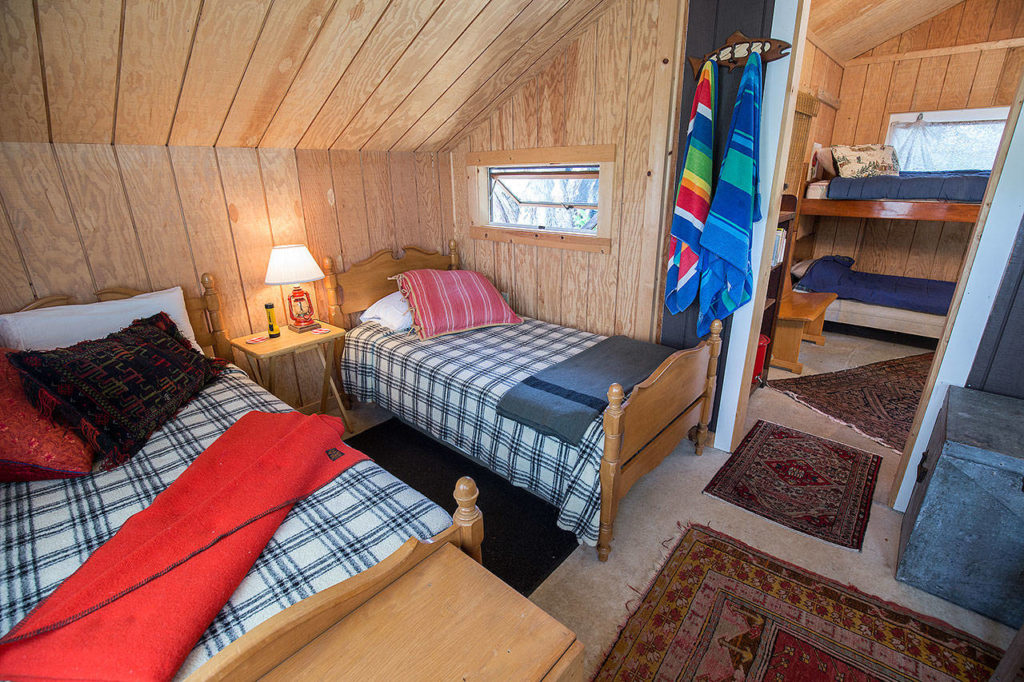 The Bunk House is the smallest cottage and the most rustic. It has two rooms and bunkbeds — and no indoor plumbing, but facilities are conveniently nearby. (Andy Bronson / The Herald)
