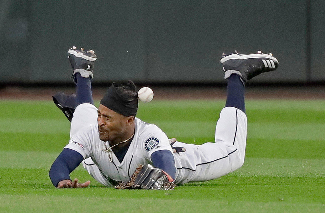 Seattle’s fielder Mallex Smith can’t come up with a sinking liner hit by Houston’s Josh Reddick during the Mariners’ 4-2 loss to the Astros on Monday in Seattle. (AP Photo/Ted S. Warren)