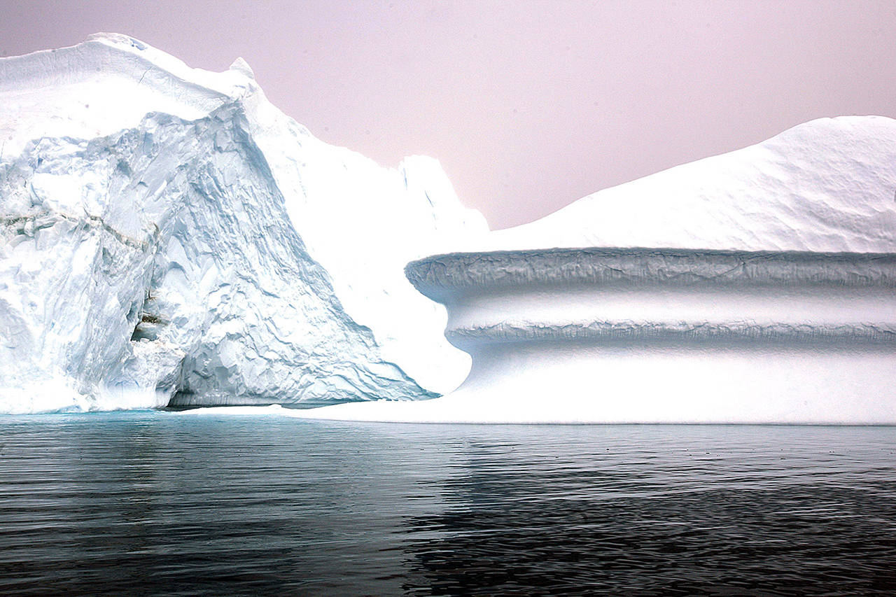Icebergs are seen off Greenland’s eastern coast in this 2007 photo near the arctic circle. (AP Photo/John McConnico, file)