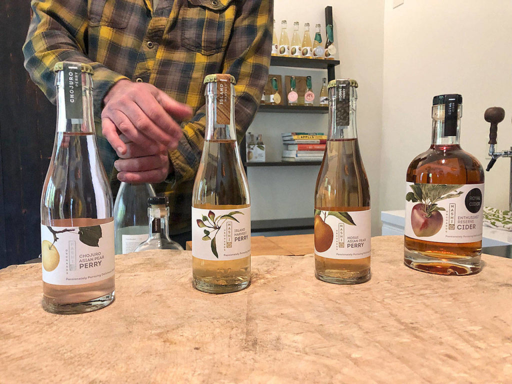 Nashi Orchards owner Jim Gerlach prepares a tasting flight at Nashi Orchards on Vashon Island. (Aaron Swaney)
