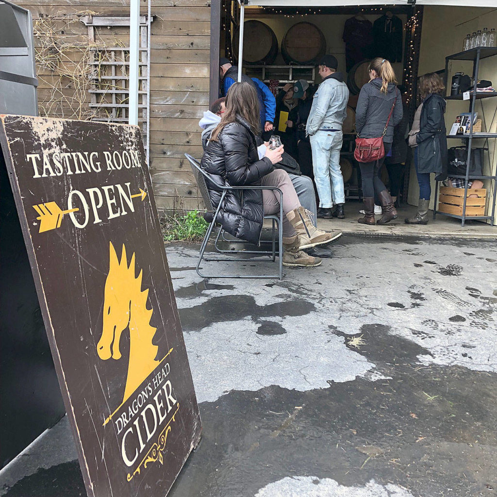 Customers enjoy cider at Dragon’s Head Cider’s tasting room on a recent weekend. Dragon’s Head Cider’s tasting room is open Friday through Sunday. (Aaron Swaney)
