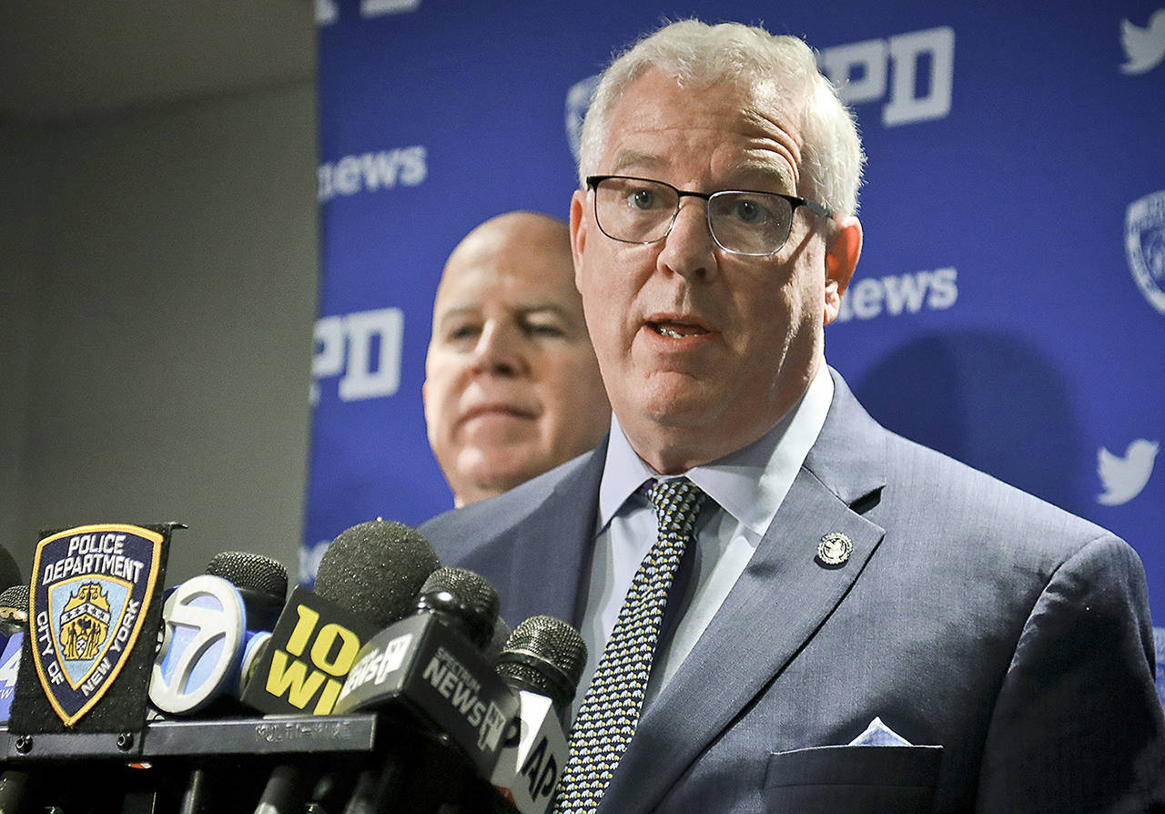 This April 18 photo shows New York Police Commissioner James O’Neill (left) and Deputy Commissioner John Miller (right). The commissioner apologized Thursday for the 1969 police raid at the Stonewall Inn, which catalyzed the modern LGBT rights movement. (AP Photo/Bebeto Matthews, File)