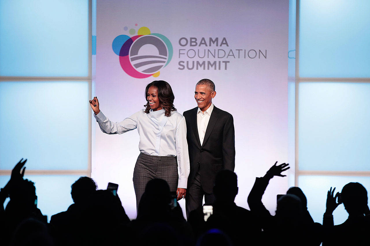 Former first Lady Michelle and former president Barack Obama, seen here at the inaugural Obama Foundation Summit on Oct. 31, 2017 in Chicago, will lend their voices to a new podcast. (Scott Olson/Getty Images)
