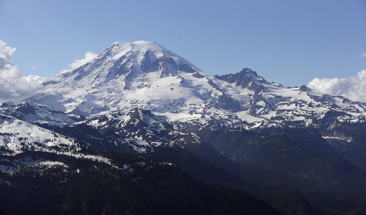 Four men in their 30s were rescued by helicopter Thursday morning and taken to Seattle’s Harborview Medical Center with injuries including altitude sickness and frostbite. (AP Photo/Elaine Thompson, File)