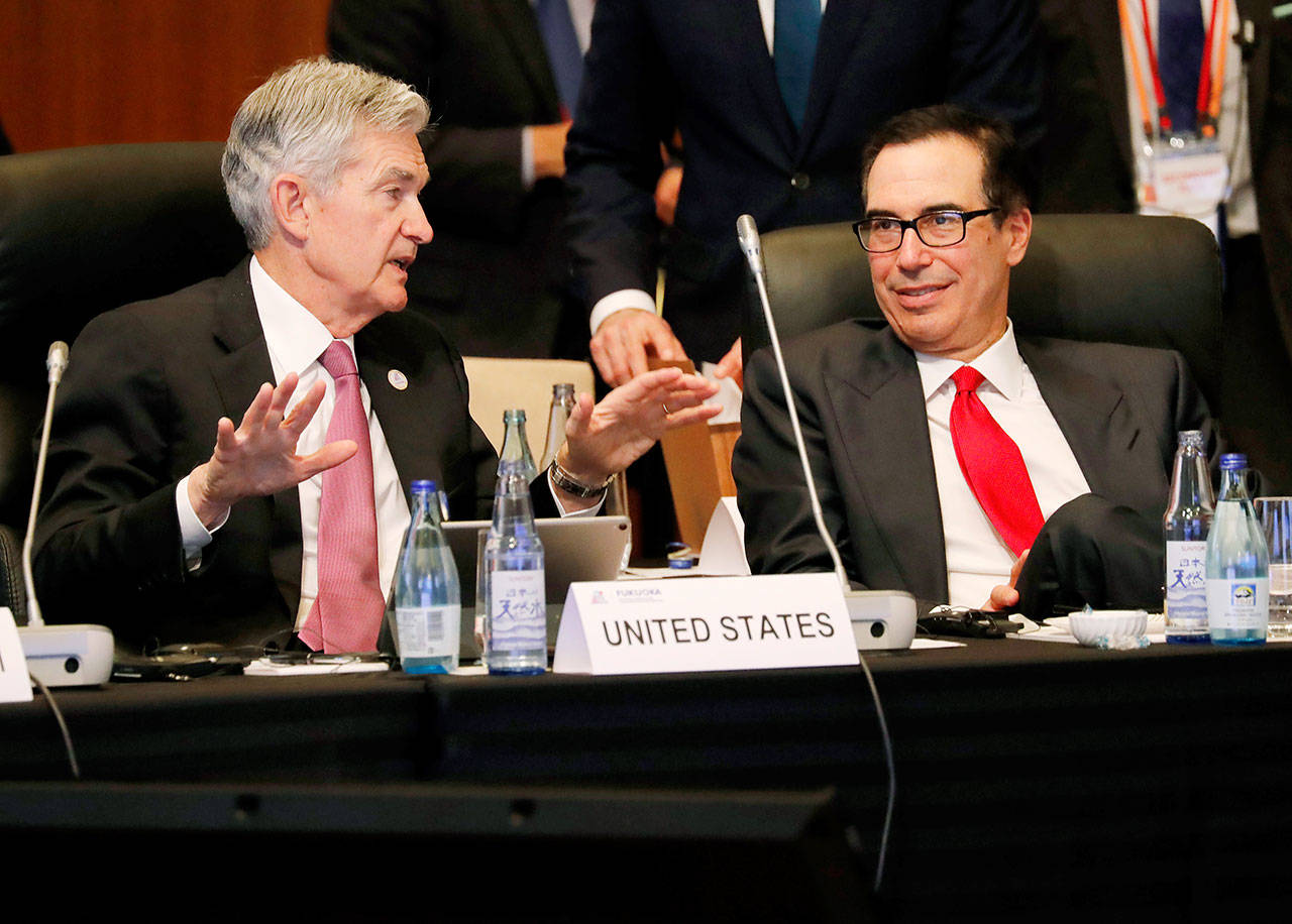 Federal Reserve Chairman Jerome Powell (left) talks with U.S. Treasury Secretary Steven Mnuchin during the G20 Finance Ministers and Central Bank governors meeting Saturday Fukuoka, Japan. (Kim Kyung-hoon/Pool Photo via AP)