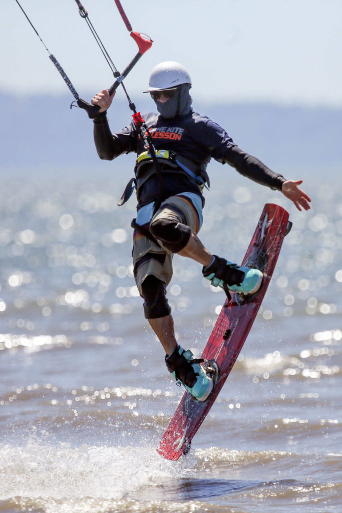 Matt Ewing kiteboards during the 2017 Jetty Island Light Wind Olympics on June 23, 2017 near Everett. The 2019 edition of the event is schedulede for this weekend. (Kevin Clark / The Herald)
