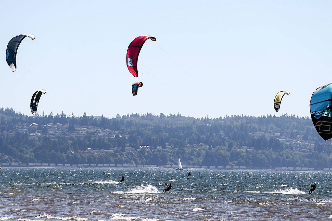 Kiteboarders will take to the surf off Jetty Island