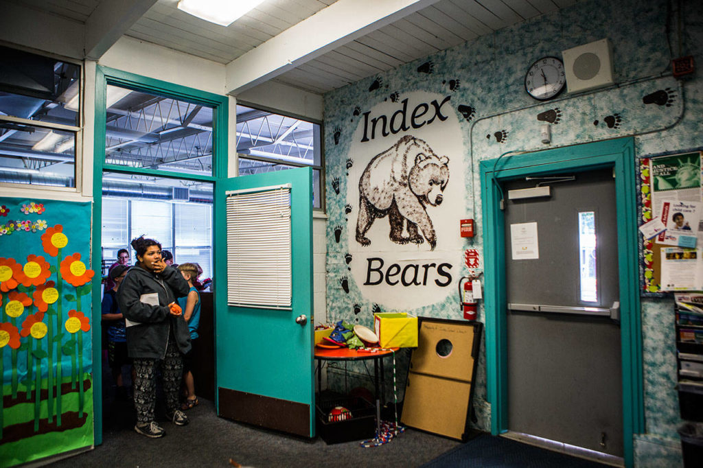 Lola Gordon, 13, waits for the final bell to ring in the doorway of her classroom during the last day of school on June 12. The area pictured is the main entryway to the school, and is one of the places expected to be remodeled. (Olivia Vanni / The Herald)
