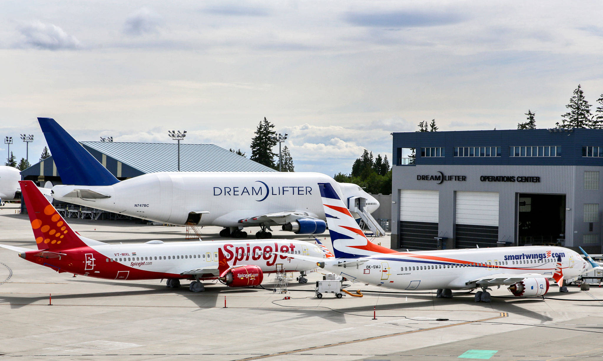 Boeing 737 Max planes (foreground) are parked near the Dreamlifter hangar on the west side of Paine Field on June 5, 2019. (Kevin Clark / The Herald)