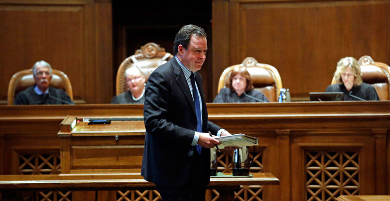 Paul J. Lawrence, attorney for the Legislature, returns to his seat after addressing justices during a hearing before the Washington Supreme Court on Tuesday, in Olympia. The court heard oral arguments in the case that will determine whether state lawmakers are subject to the same disclosure rules that apply to other elected officials under the voter-approved Public Records Act. The hearing before the high court was an appeal of a case that was sparked by a September 2017 lawsuit filed by a media coalition, led by The Associated Press. (Elaine Thompson / The Associated Press)