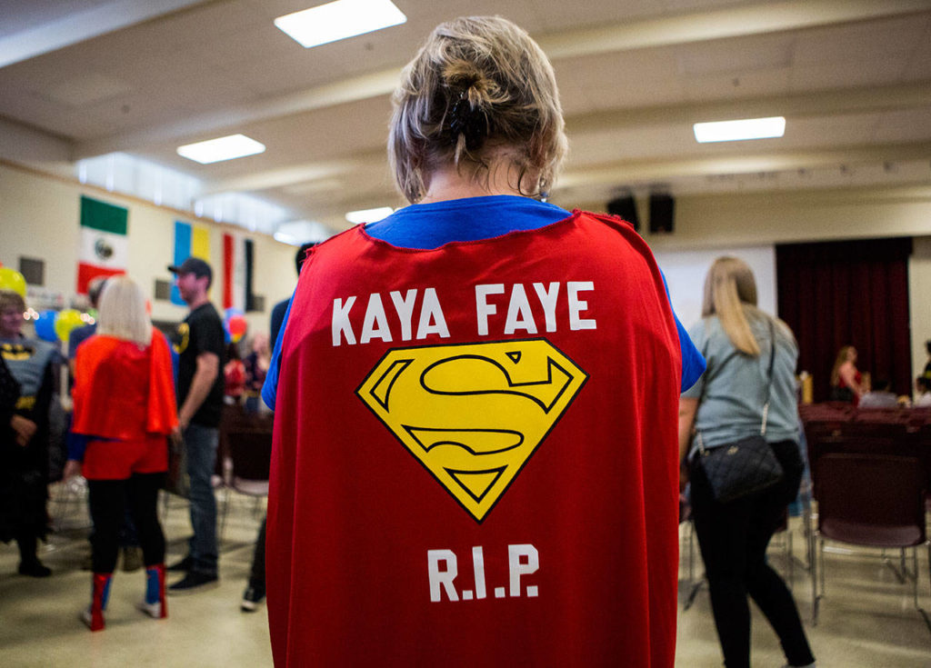 Lori Shile, a friend of Kaya’s family, wears a Superman cape she made for Kaya’s superhero-themed memorial at Emerson Elementary on June 1, 2019 in Everett. (Olivia Vanni / The Herald)
