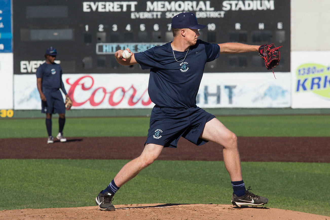 Everett AquaSox forth-round draft pick and pitcher Tim Elliott throws to first base on the first day of practice at Funko Field on Tuesday, June 11, 2019 in Everett, Wash. (Andy Bronson / The Herald)