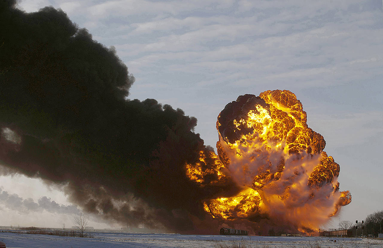 In this 2013 photo, a fireball goes up at the site of an oil train derailment near Casselton, North Dakota. (AP Photo/Bruce Crummy, File)