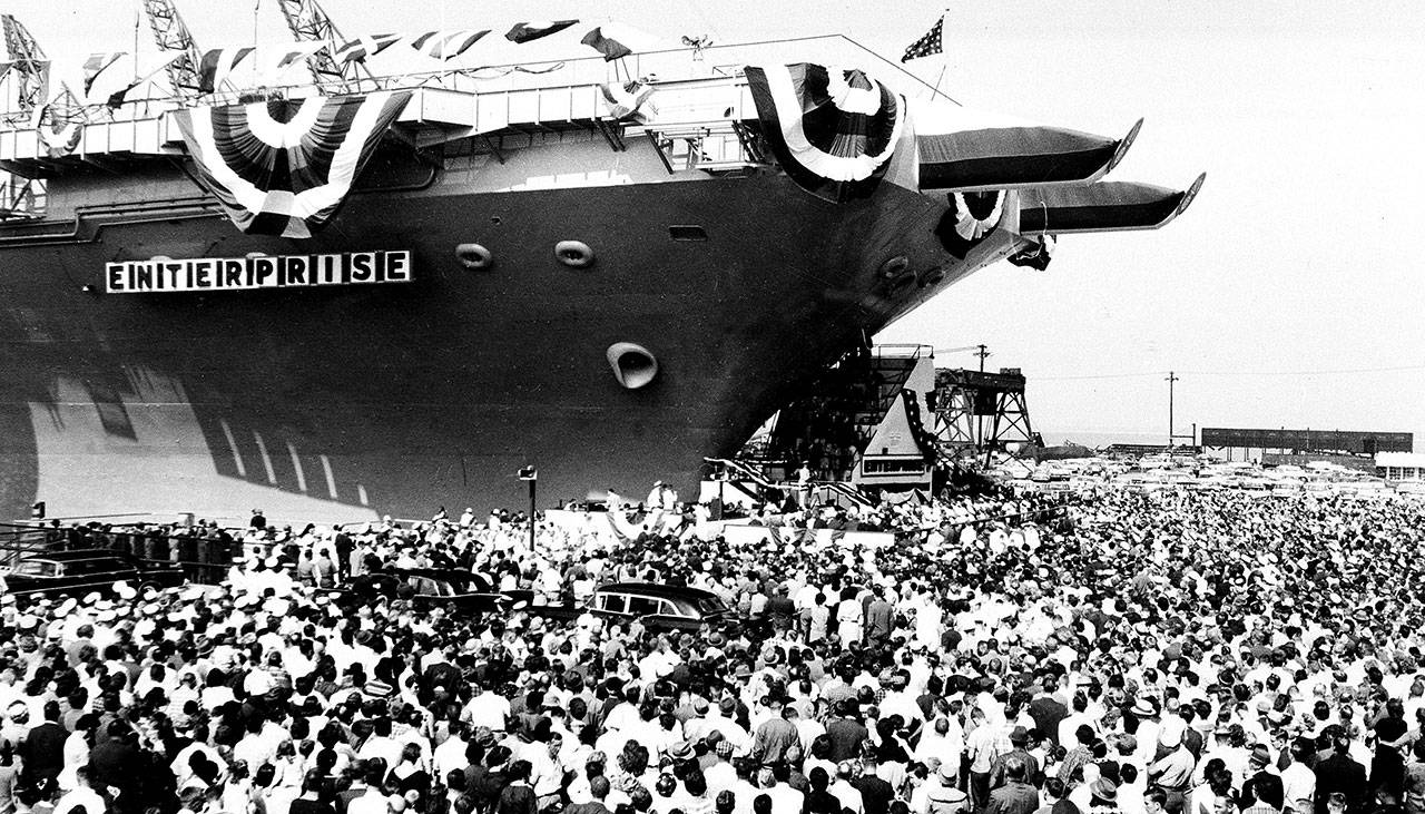 A throng estimated at 15,000 gathers to watch the christening of the USS Enterprise, the world’s first nuclear-powered aircraft carrier, at Newport News, Virginia, on Sept. 24, 1960. (Associated Press archive)