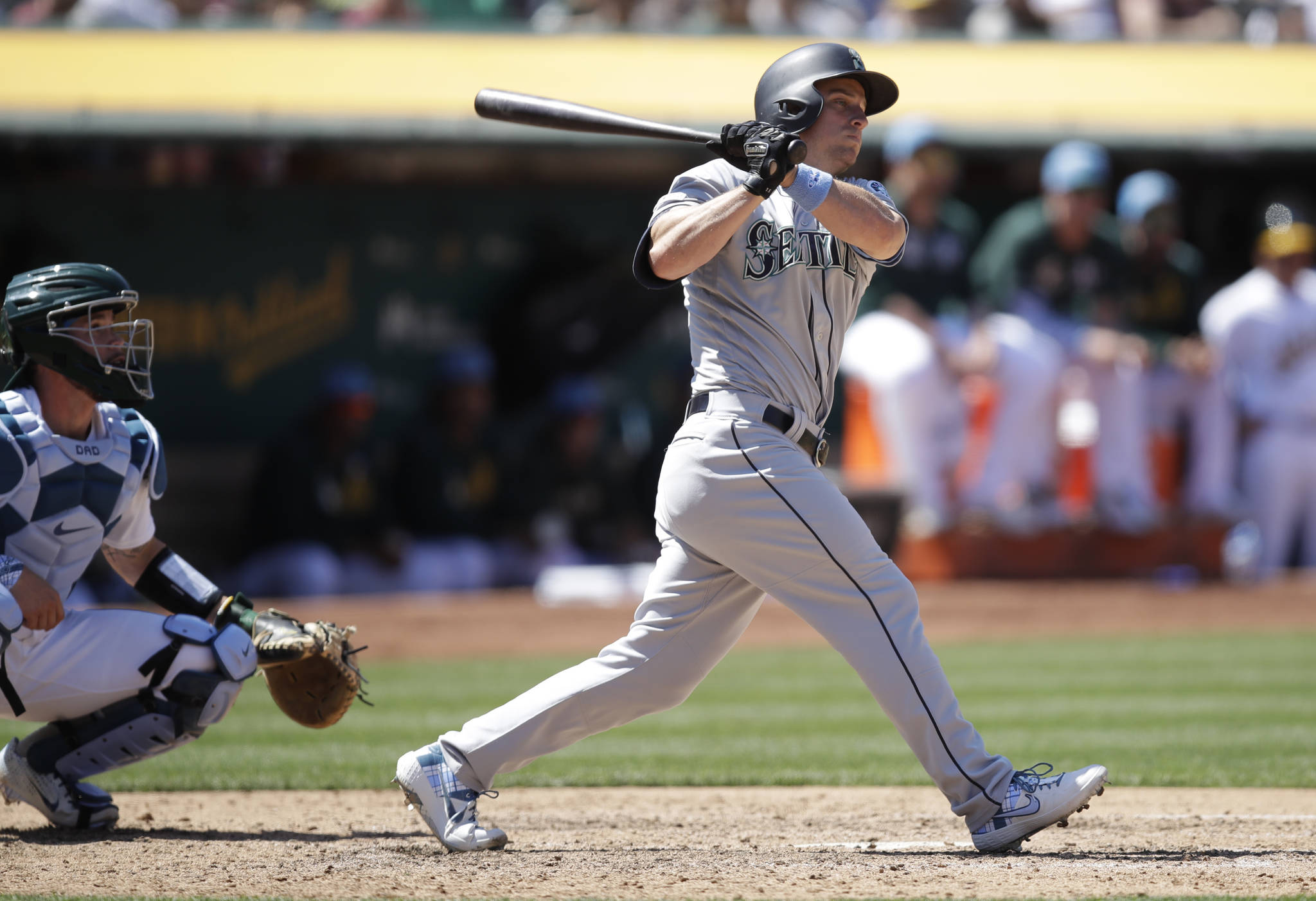 Seattle’s Kyle Seager watches the two-run double he hit off Oakland’s Lou Trivino in the eighth inning of Sunday’s game in Oakland, California. (AP Photo/Ben Margot)