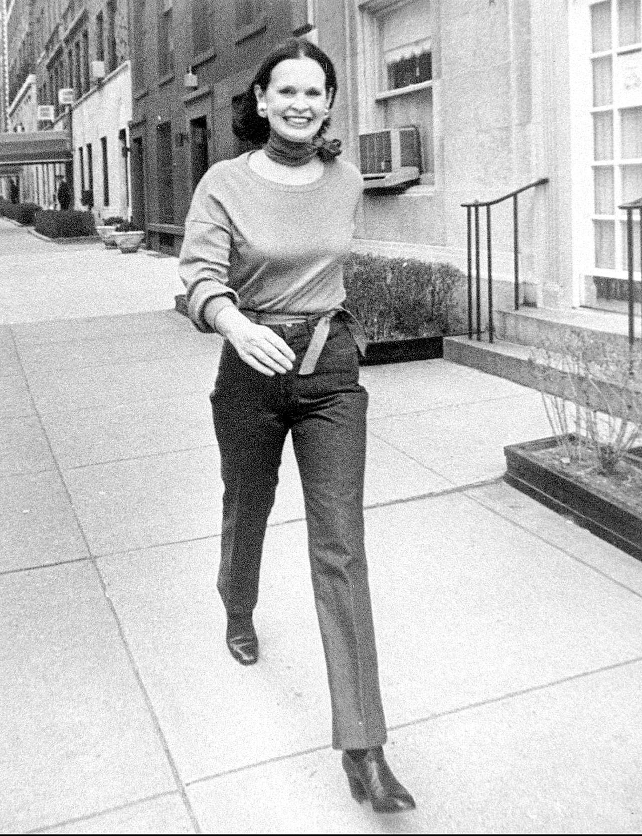 Heiress and designer Gloria Vanderbilt walks down a New York street. Vanderbilt died on Monday at 95, according to her son, CNN anchor Anderson Cooper. (New York Post via AP, File)