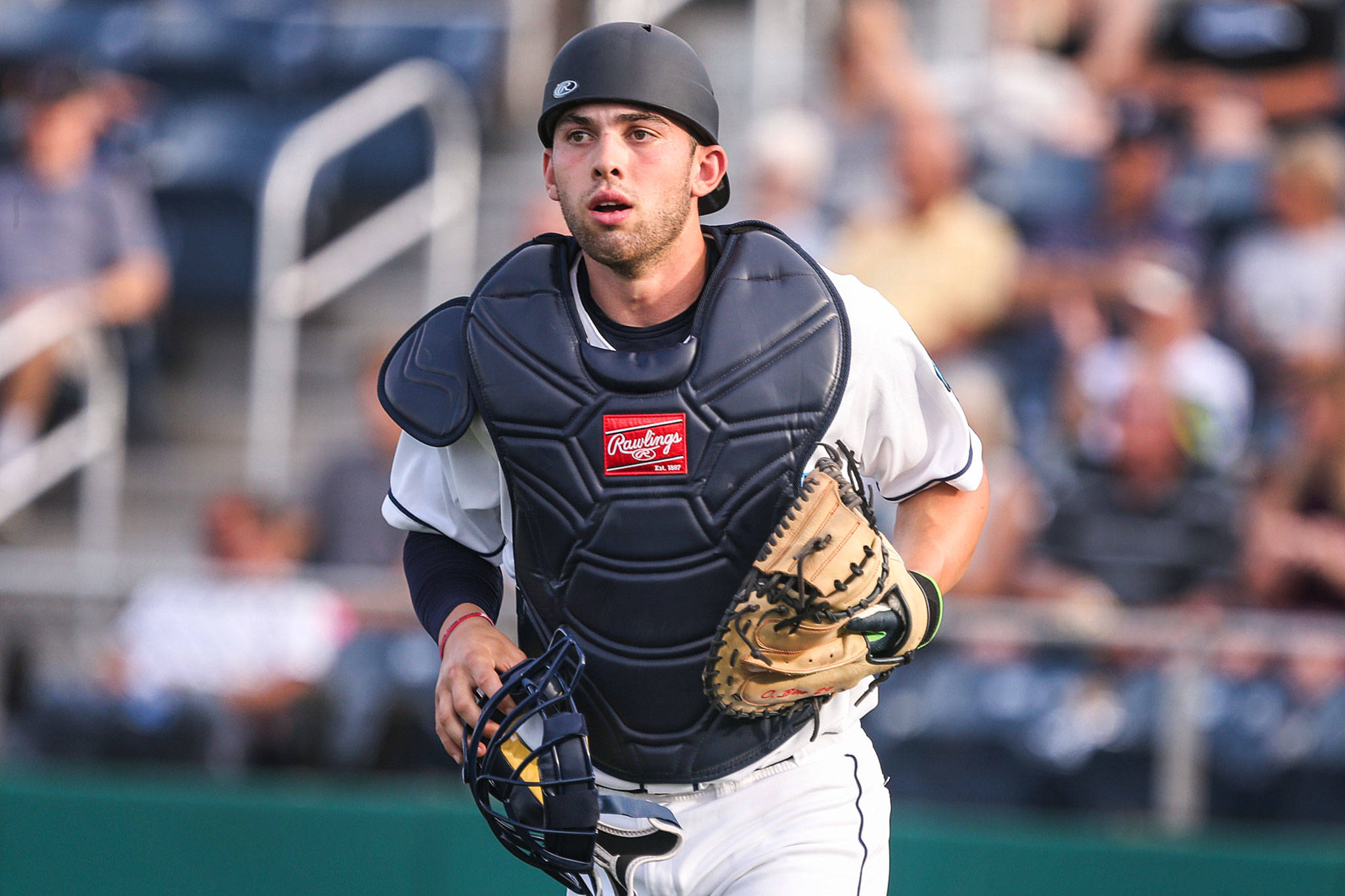 The AquaSox’s Carter Bins makes his way to the dugout during an exhibition game against the Merchants on June 12, 2019, at Funko Field at Everett Memorial Stadium. (Kevin Clark / The Herald)