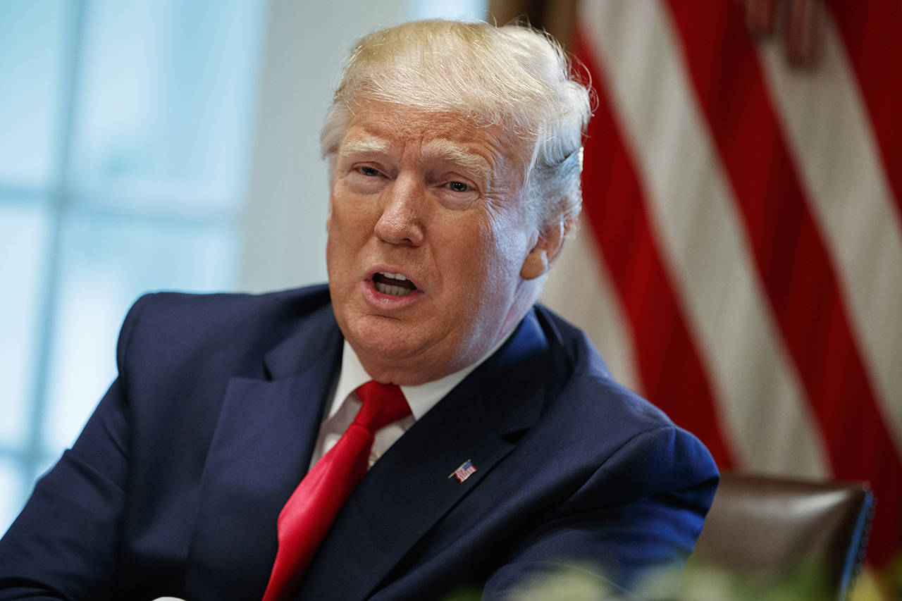 In this June 13 photo, President Donald Trump speaks during a meeting in the Cabinet Room of the White House, in Washington. In a tweet late Monday, Trump said that U.S. Immigration and Customs Enforcement will begin removing millions of people who are in the country illegally. (AP Photo/Evan Vucci, File)
