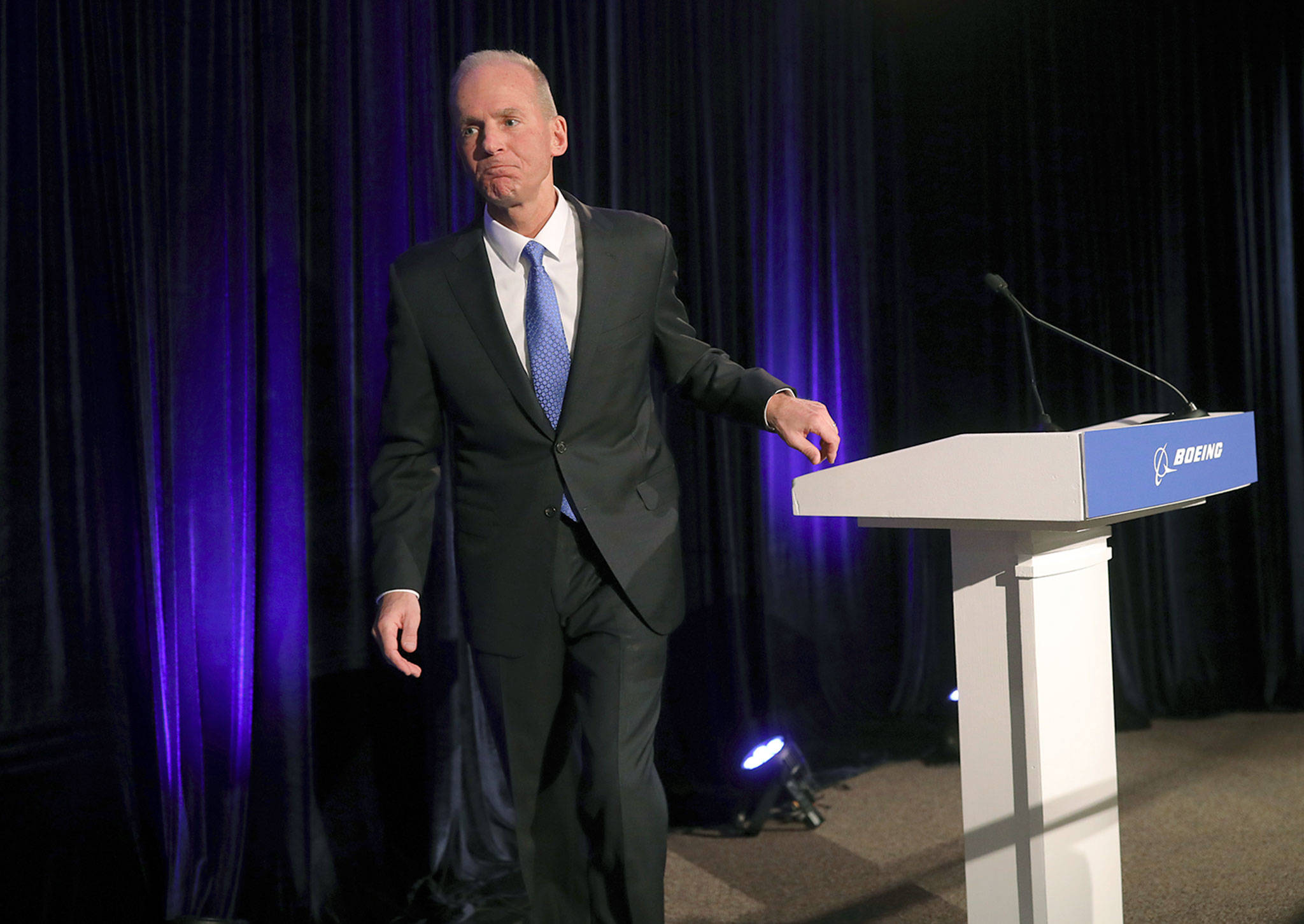 Boeing Chief Executive Officer Dennis Muilenburg leaves after speaking at a news conference after the company’s annual shareholders meeting at the Field Museum in Chicago on April 29. (John Gress/Pool Photo via AP)
