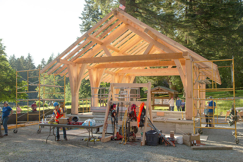 Members of the Timber Framers Guild and volunteers raised a picnic shelter at Lake Roesiger county park in late May. (Rich Patton)
