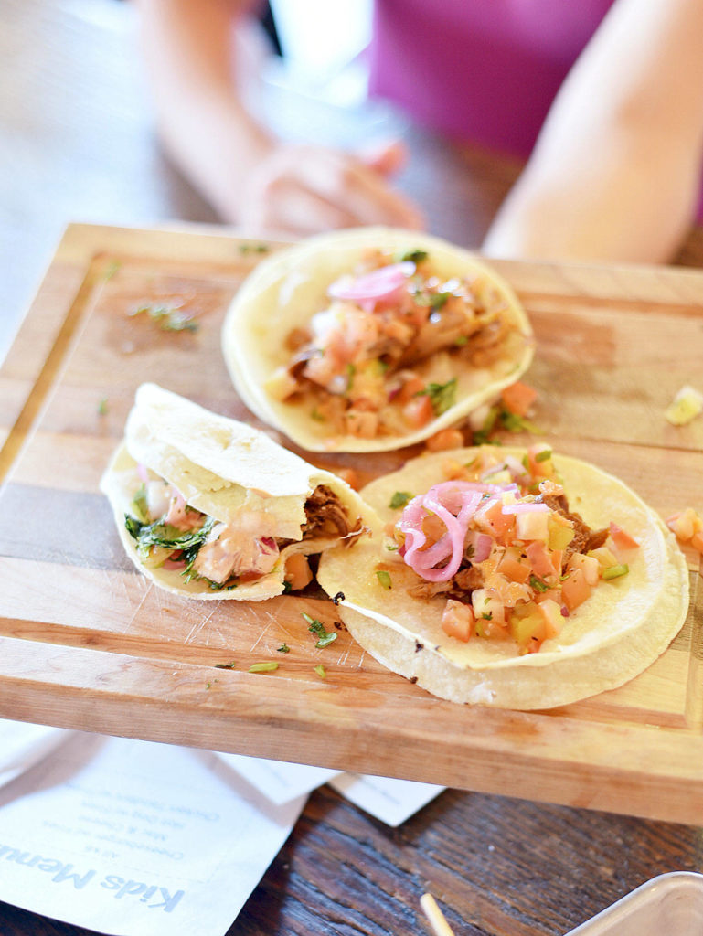 Street tacos at Sound to Summit Brewing come with three in a choice of either chicken or pork. These pork tacos were juicy and delicious. (Miles McKee / For the Herald)
