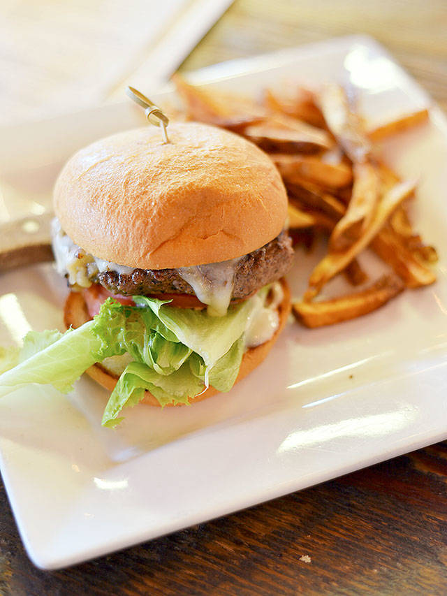 Sound to Summit Brewing’s elk burger is a juicy, hefty haul of gamey meat. (Miles McKee / For The Herald)