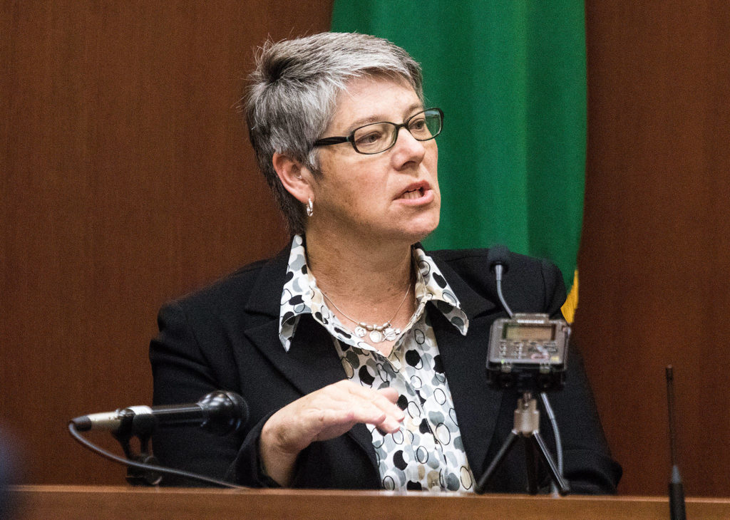 Jennifer Sheahan-Lee, detective sergeant with the Skagit County Sheriff’s Office, recounts how she found a .380-caliber shell casing under a leaf, while testifying at the trial for William Talbott II on Thursday at the Snohomish County Courthouse in Everett. (Andy Bronson / The Herald/POOL)
