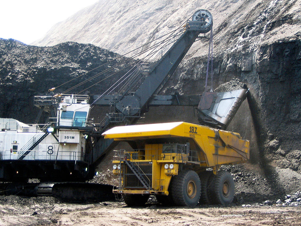 A shovel prepares to dump a load of coal into a 320-ton truck at the Arch Coal Inc.-owned Black Thunder mine in Wright, Wyoming, in 2007. Two of the world’s largest coal producers have announced a plan to combine their mining operations in Wyoming and Colorado in a bid to improve their competitiveness against growing natural gas and renewable energy sources. Arch Coal and Peabody Energy, both based in St. Louis on Wednesday announced the joint venture. It will be 66.5% owned by Peabody and 33.5% owned by Arch. (AP Photo/Matthew Brown, File)