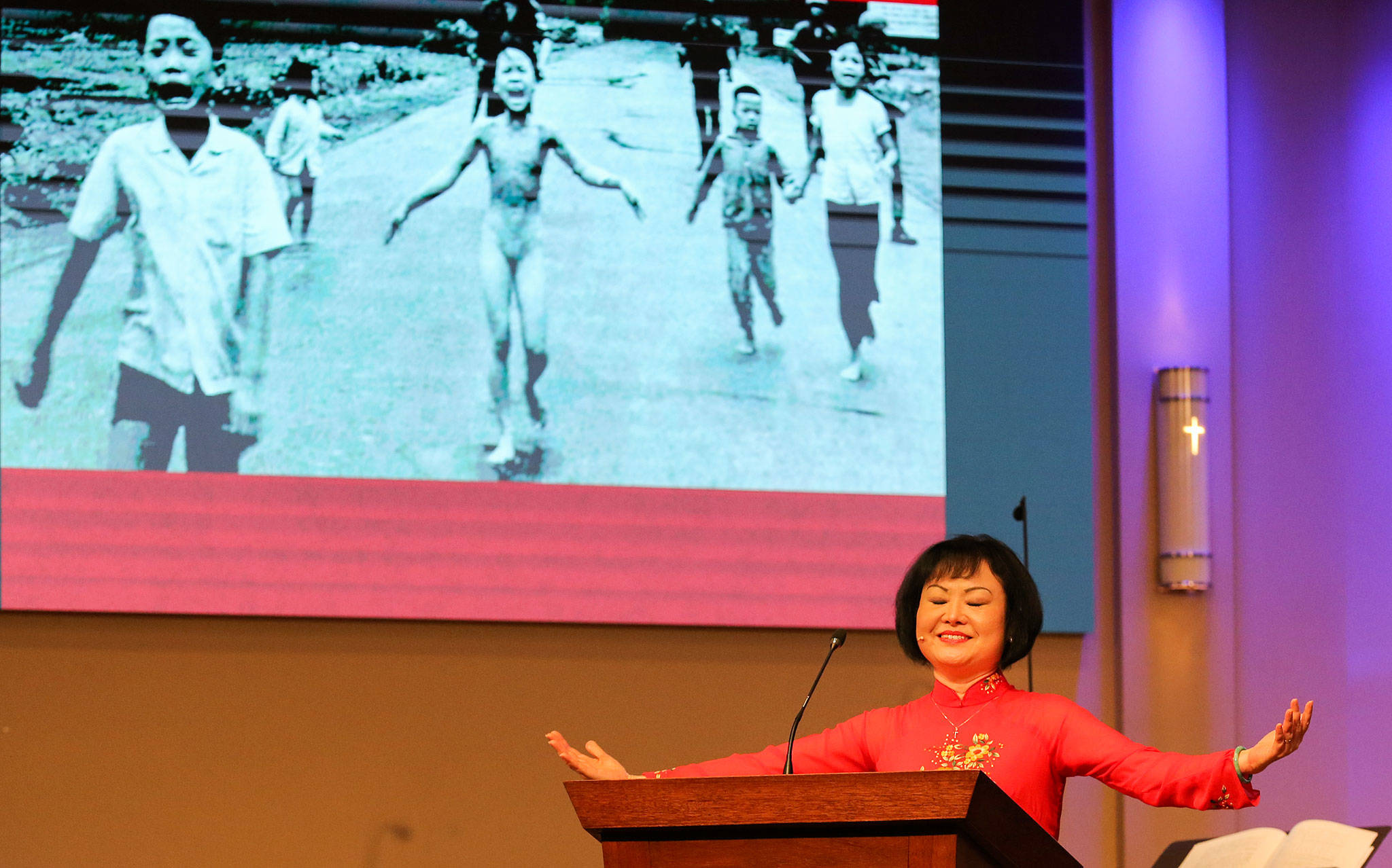 Phan Thi Kim Phúc, known as “The Napalm Girl” because of a Vietnam War photograph of her as a child, addresses the congregation of Open Door Baptist Church in Lynnwood on Sunday morning. (Kevin Clark / The Herald)