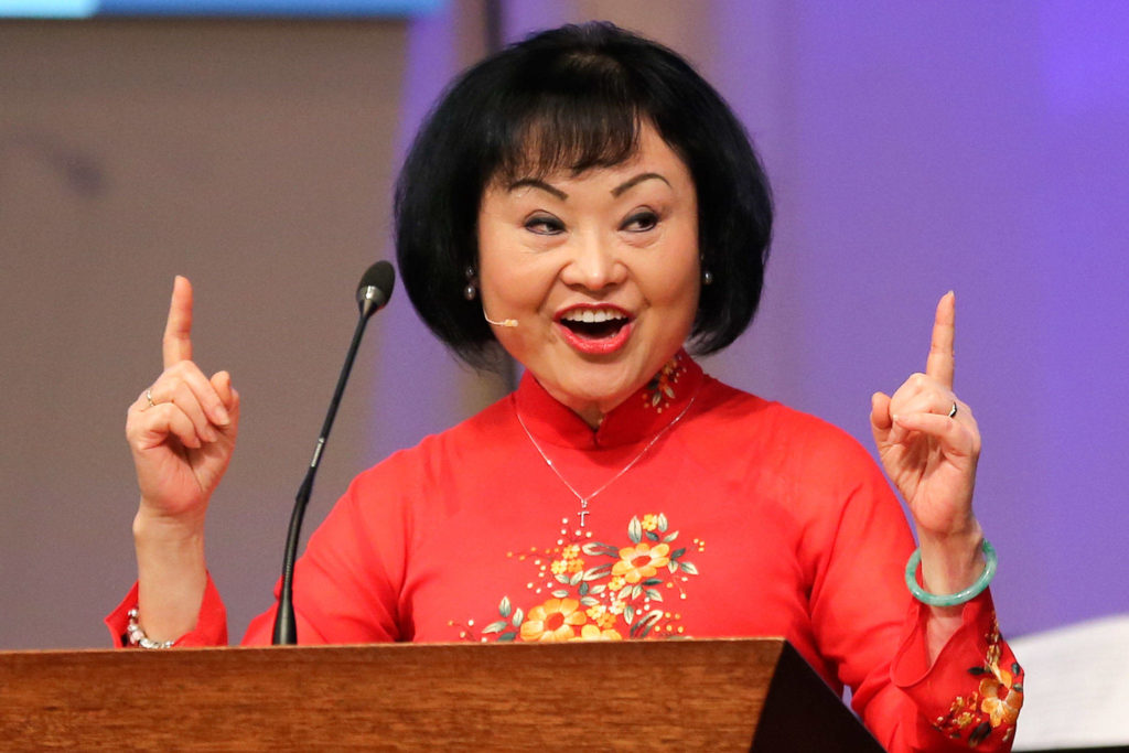 Phan Thi Kim Phuc, known as “The Napalm Girl,” addresses the congregation of Open Door Baptist Church in Lynnwood on Sunday morning. (Kevin Clark / The Herald)
