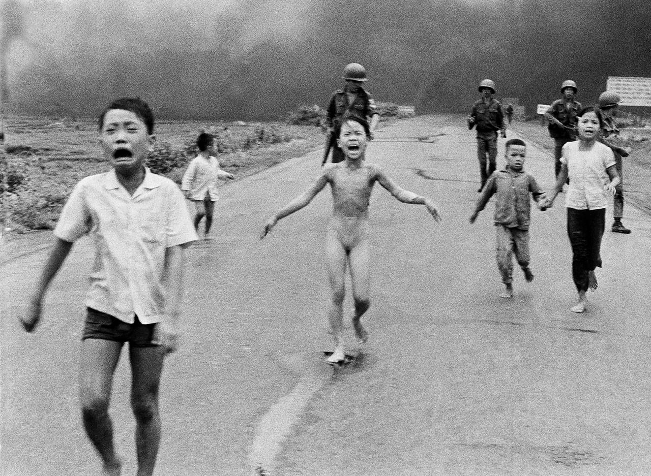 In this June 8, 1972, file photo, 9-year-old Kim Phúc, center, runs with her brothers and cousins, followed by South Vietnamese forces, down Route 1 near Trang Bang after a South Vietnamese plane accidentally dropped its flaming napalm on its own troops and civilians. The terrified girl had ripped off her burning clothes while fleeing. She spoke about her life and Christian faith Sunday at Open Door Baptist Church in Lynnwood. (AP Photo/Nick Ut, File)
