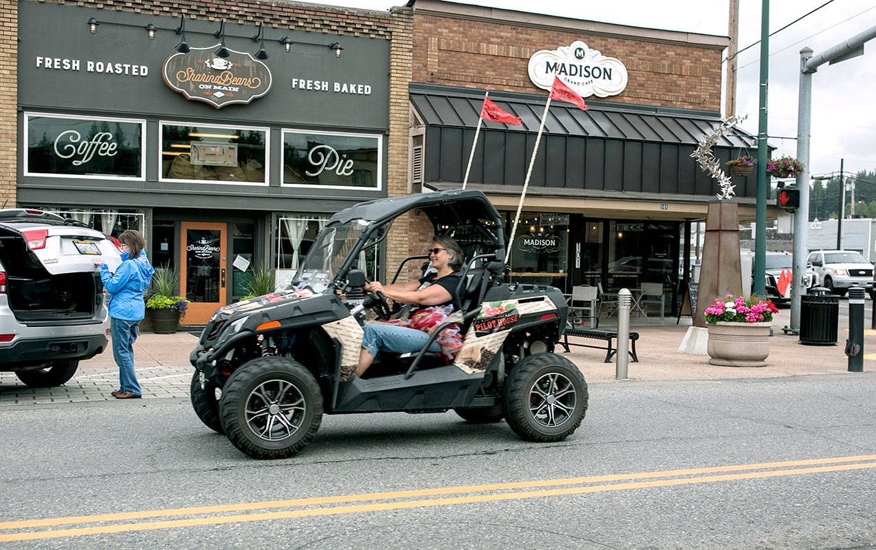 Michelle Walker, known as “the caffeinator,” can be seen zipping around Monroe in an ATV delivering coffee for the Original Pilot Coffee House. ATV riders should soon be able to ride some city streets in Gold Bar. (Julia-Grace Sanders/ The Herald)