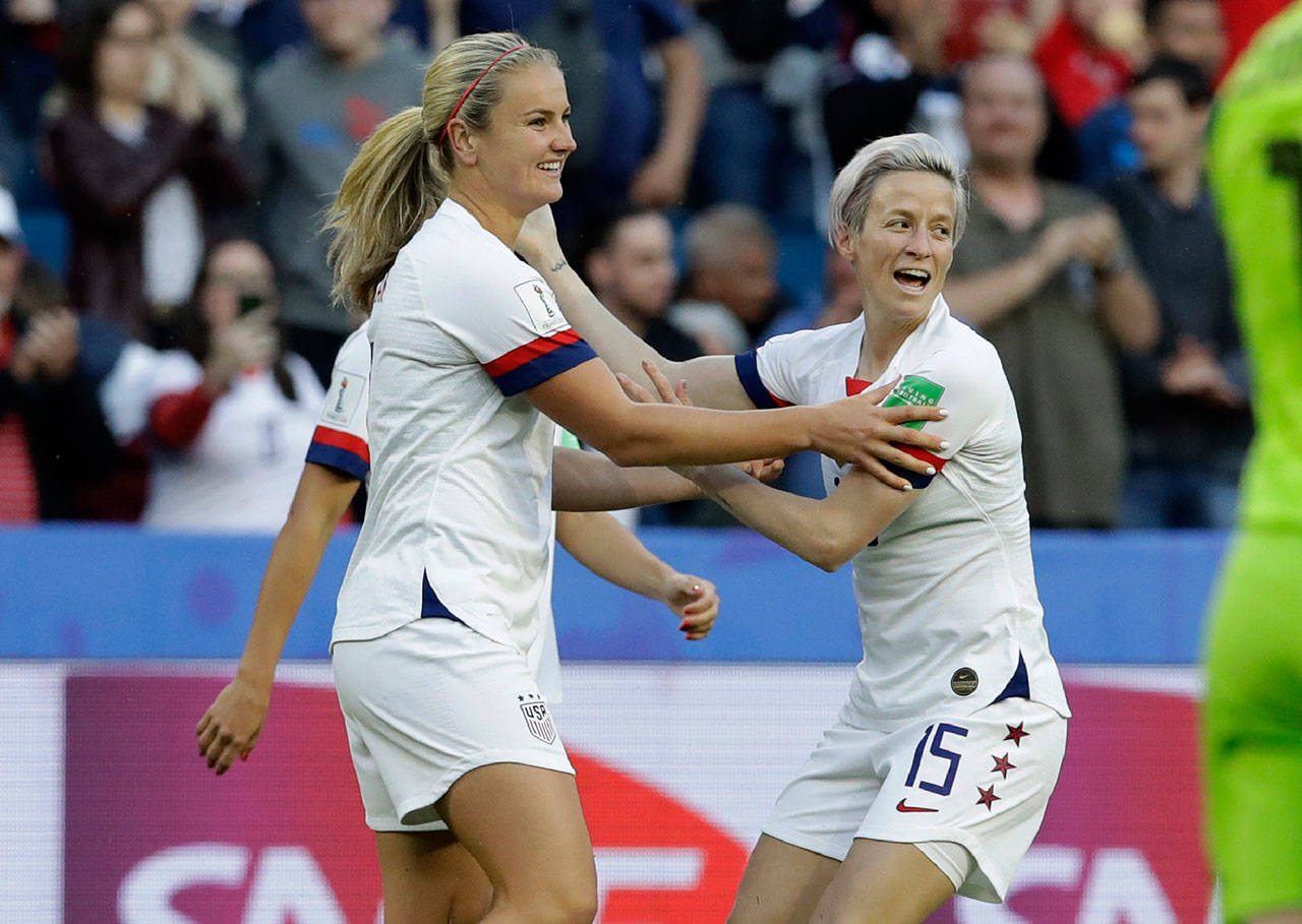 The United States’ Lindsey Horan (left) is congratulated by Megan Rapinoe after scoring a goal during a Women’s World Cup match against Sweden on June 20, 2019, in Le Havre, France. (AP Photo/Alessandra Tarantino)